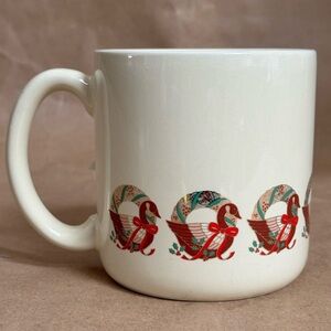 Vintage 1986 Hallmark Cream Mug with Goose and Wreath Pattern.